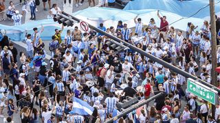 Miami Beach, Florida, crowds of Argentinian soccer, futbol fans celebrating FIFA World Cup victory.